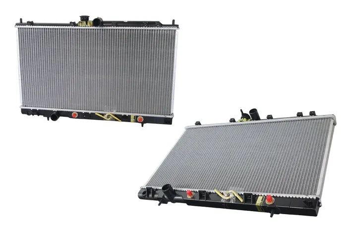 Two automotive radiators shown on a plain white background, one upright and one angled to show the top and side view.

