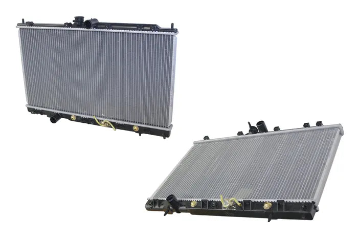 Two automotive radiators shown from different angles on a plain white background, with silver ribbed cores and black end tanks.

