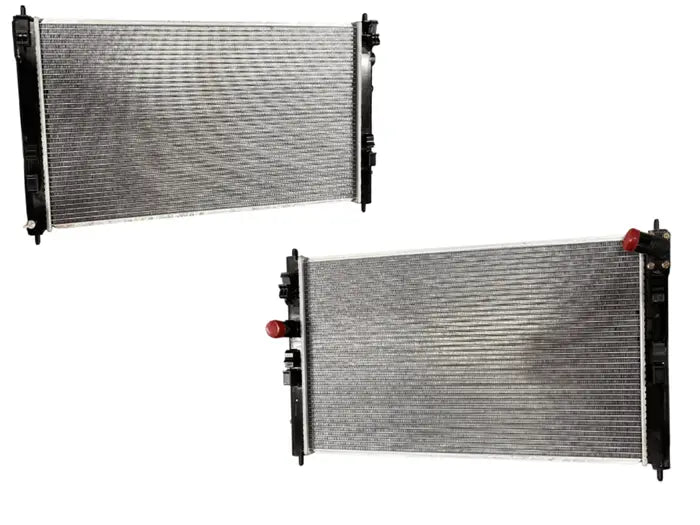 Two silver and black automotive radiators shown on a plain white background.

