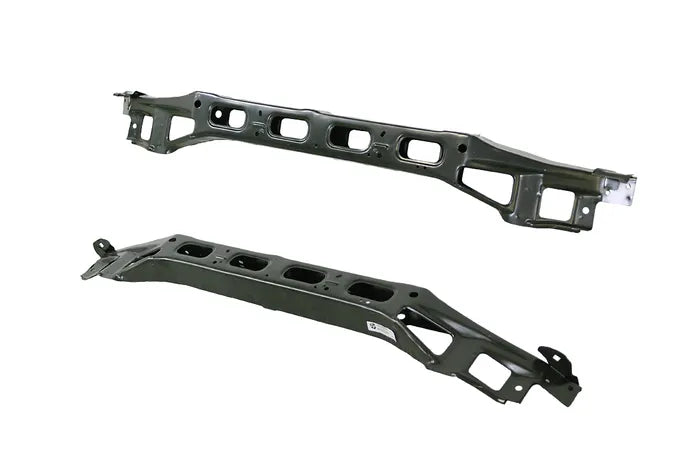 Two metal engine manifold parts on a white background

