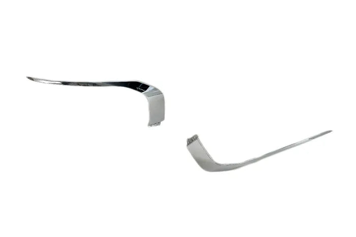 A pair of chrome curved trim pieces, likely for a vehicle door or fender, displayed on a solid white background.

