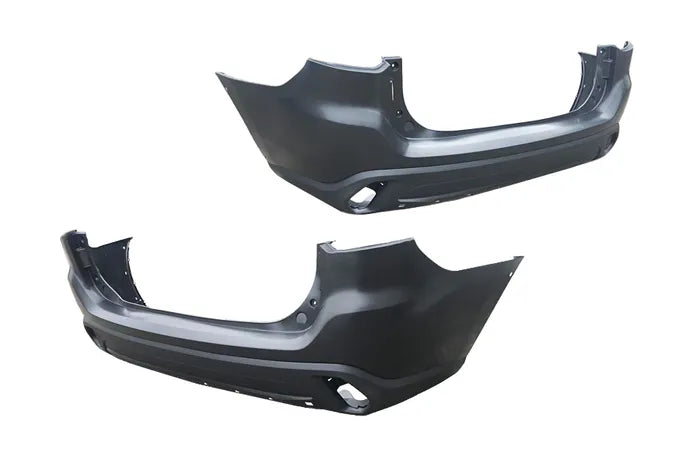 Two car bumper parts on a white background

